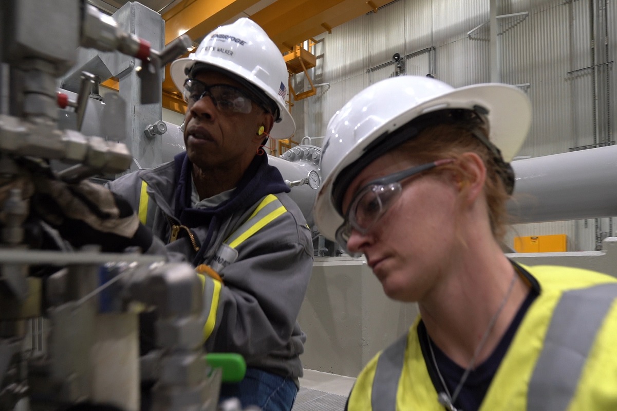 Workers at an Enbridge compressor station